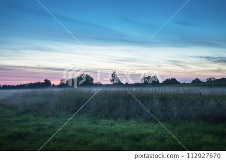 Evening sky over a foggy meadow, Zarzecze, Poland Evening sky over a foggy meadow, Zarzecze, Poland 112927670