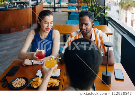 Diverse group of people meeting cafe to celebrate personal event 112928542