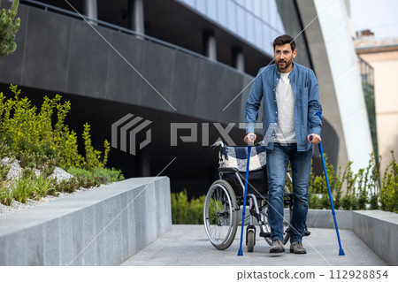 Young disabled man on a wheelchair 112928854