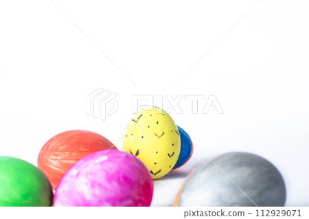 Colorful easter eggs on white background with copy space for text. Colorful easter eggs on white background with copy space for text. 112929071