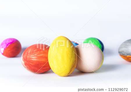 Colorful easter eggs on white background with copy space for text. Colorful easter eggs on white background with copy space for text. 112929072