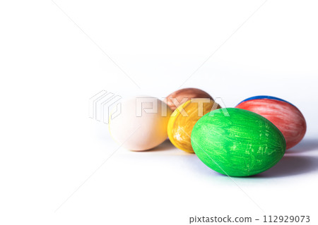 Colorful painted Easter eggs isolated on white background with copy space Colorful painted Easter eggs isolated on white background with copy space 112929073