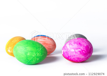 Colorful easter eggs on white background with copy space for text. Colorful easter eggs on white background with copy space for text. 112929074
