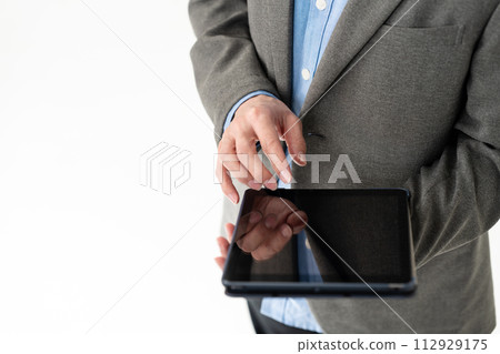 Men with tablets Men with tablets 112929175