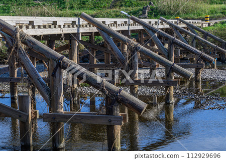 quirky wooden bridge 112929696