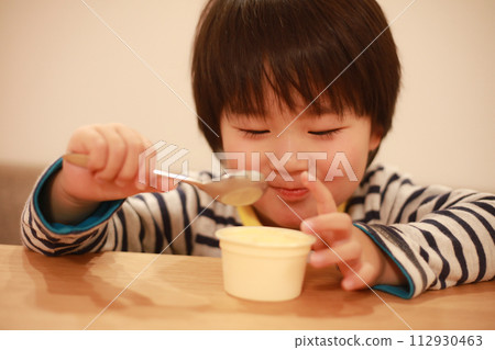 A boy who eats ice cream A boy who eats ice cream 112930463