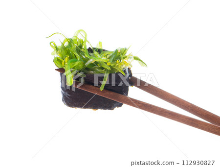 Sushi Sushi in chopsticks 112930827