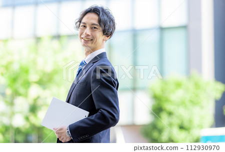 Businessman outside male Businessman outside male 112930970