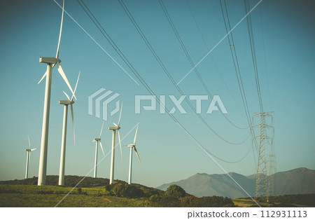 wind generator and high-voltage lines in a field 112931113