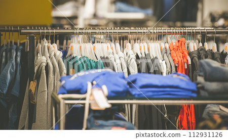 hangers with men's clothes in shop hangers with men's clothes in shop 112931126