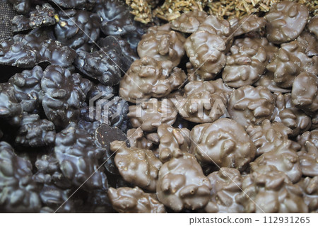 close up of peanut chocolate candy on table close up of peanut chocolate candy on table 112931265
