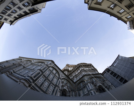 fisheye unusual view Cathedral Santa Maria dei Fiori, Brunelleschi Dome and Giotto Tower in Florence Italy 112931374