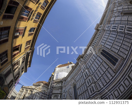 fisheye unusual view Cathedral Santa Maria dei Fiori, Brunelleschi Dome and Giotto Tower in Florence Italy 112931375