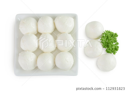 Mini mozzarella balls with parsley in a ceramic bowl isolated on white background. Top view. Flat lay. 112931823