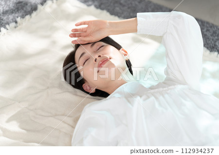 woman taking a nap in the room woman taking a nap in the room 112934237