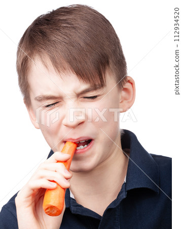 Boy Dislikes Eating Carrot 112934520