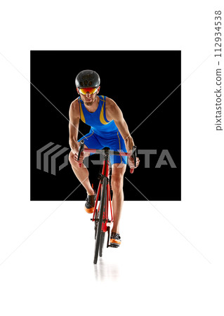 Front view image of man, athlete in sportswear helmet and goggles in motion training on bike isolated on white background with black element. Front view image of man, athlete in sportswear helmet and goggles in motion training on bike isolated on white background with black element. 112934538