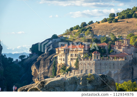 Greek Rock Monastery and Blue Sky and Tourists Greek Rock Monastery and Blue Sky and Tourists 112934976