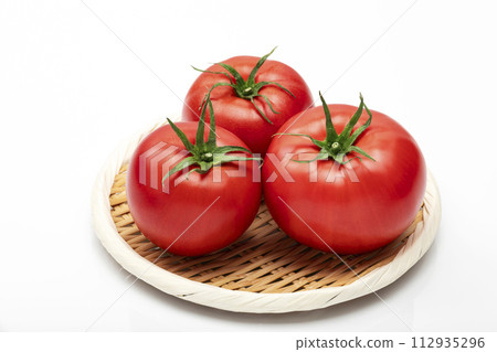 Tomatoes on a white background in a tray 112935296