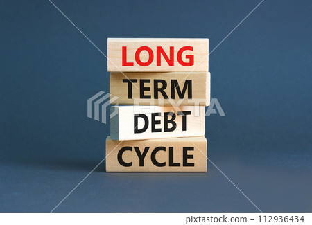 Long term debt cycle symbol. Concept words Long term debt cycle on beautiful wooden block. Beautiful grey table grey background. Business Long term debt cycle concept. Copy space. 112936434