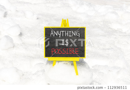 Anything is possible symbol. Concept words Anything is possible on beautiful black chalk blackboard. Beautiful white snow background. Business anything possible concept. Copy space. 112936511