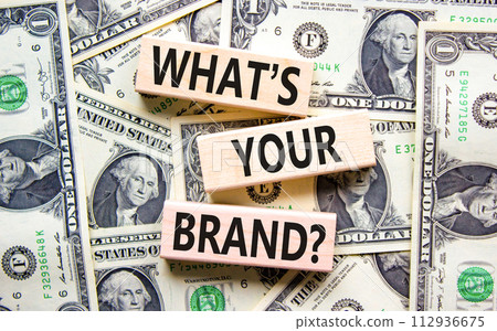 Branding and what is your brand symbol. Concept words What is your brand on beautiful blocks. Dollar bills. Beautiful dollar bills background. Business branding what is your brand concept. Copy space. 112936675