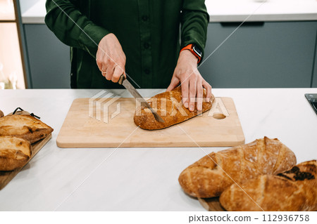 Artisan Sourdough Bread Preparation on Wooden Board 112936758