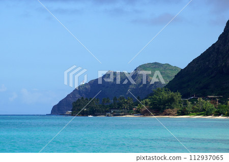 Waimanalo beach, bay, and Makapuu Point with Makapu'u Lighthouse visible on cliffside mountain Waimanalo beach, bay, and Makapuu Point with Makapu'u Lighthouse visible on cliffside mountain 112937065