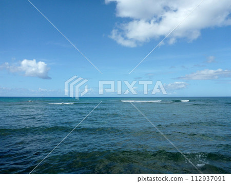 Shallow ocean waters with small waves breaking in the distance Shallow ocean waters with small waves breaking in the distance 112937091