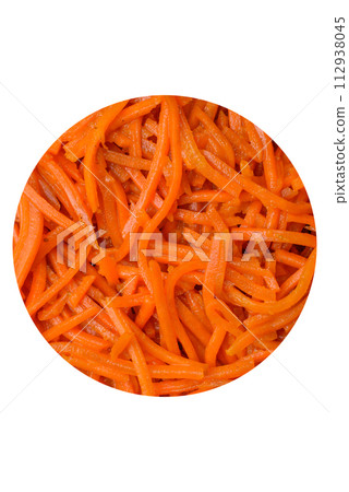 Tasty spicy Korean carrot with spices and herbs on a dark concrete background 112938045