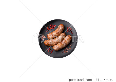 Grilled sausages with spices and herbs. With copy space Grilled sausages with spices and herbs. With copy space 112938050