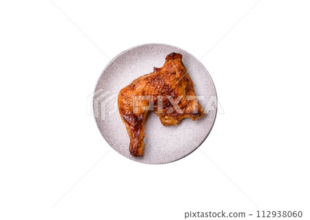 Delicious grilled chicken leg or quarter with salt and spices Delicious grilled chicken leg or quarter with salt and spices 112938060