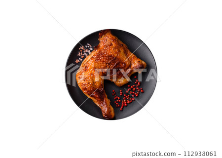Delicious grilled chicken leg or quarter with salt and spices Delicious grilled chicken leg or quarter with salt and spices 112938061