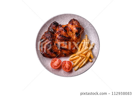 Fresh juicy delicious beef steak on a dark background Fresh juicy delicious beef steak on a dark background 112938083