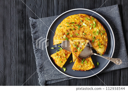spanish potato omelette tortilla espanola on plate 112938544