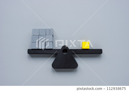 Scales with gray cubes and one yellow one. Be different, unique. Scales with gray cubes and one yellow one. Be different, unique. 112938675