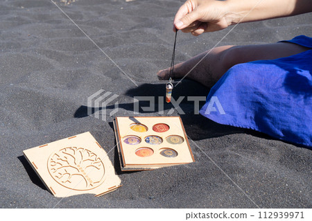 Healing crystals on black sand background 112939971