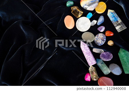 Healing crystals on brown background Healing crystals on brown background 112940008