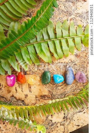 Healing crystals on brown background 112940031