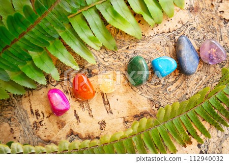 Healing crystals on brown background 112940032