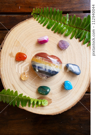 Healing crystals on brown background Healing crystals on brown background 112940044