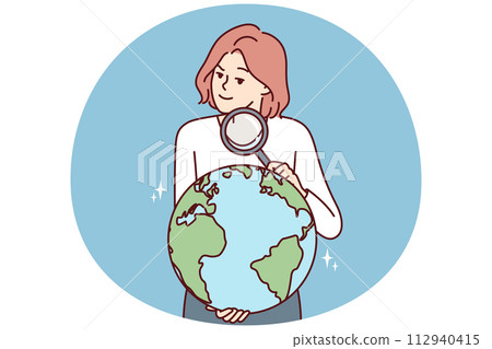Woman with magnifying glass holds globe studying geography or choosing place for further travel 112940415