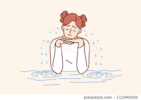 Teenage woman is crying sitting at table, experiencing stress and depression due to school bullying 112940450