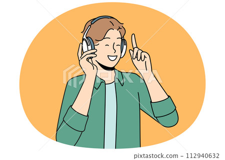 Smiling man in headphones listen to music 112940632