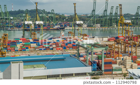 Commercial port of Singapore timelapse. Bird eye panoramic view of busiest Asian cargo port 112940798