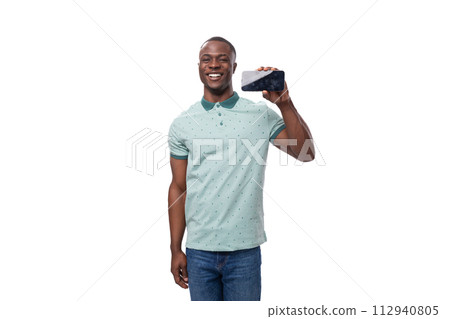 young african man dressed casually showing smartphone screen with mockup standing on white 112940805