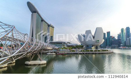 View of The Helix Bridge in Singapore day to night timelapse. 112940814