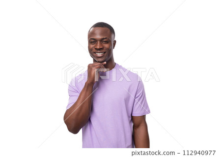 young positive american man in lilac t-shirt smiling on white background young positive american man in lilac t-shirt smiling on white background 112940977