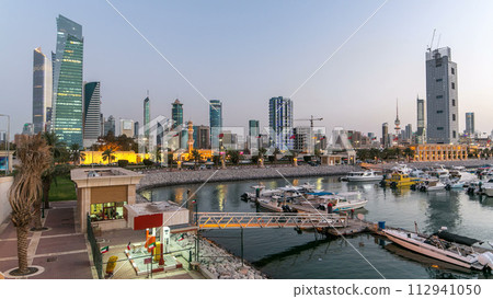 Yachts and boats at the Sharq Marina day to night timelapse in Kuwait. Kuwait City, Middle East Yachts and boats at the Sharq Marina day to night timelapse in Kuwait. Kuwait City, Middle East 112941050