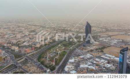 Kuwait City cityscape day to night timelapse is the capital of Kuwait. Sunset time. 112941079
